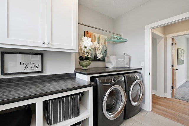 16999 Dakota St NW, Andover, MN 55304 - washroom with cabinet space, washing machine and dryer, light wood-type flooring, and baseboards