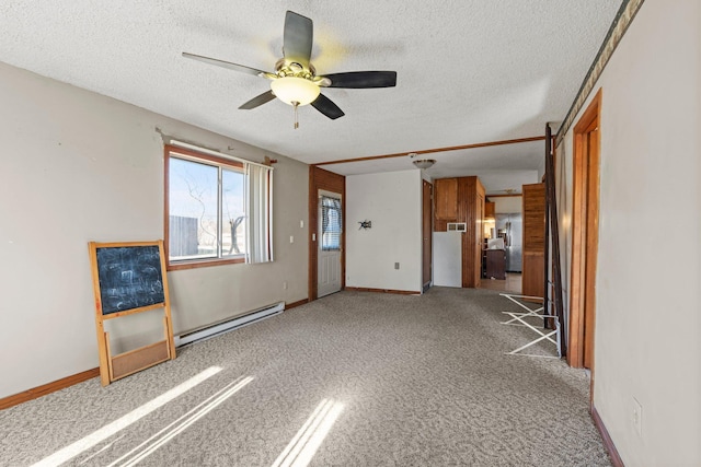 27928 Verdin St NW, Isanti, MN 55040 - unfurnished living room featuring carpet floors, a baseboard radiator, ceiling fan, and a textured ceiling