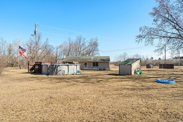 27928 Verdin St NW, Isanti, MN 55040 - view of yard featuring an outbuilding, a shed, and an outdoor pool