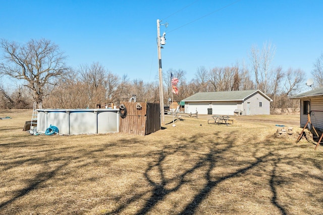 27928 Verdin St NW, Isanti, MN 55040 - view of yard with a detached garage and an outdoor pool