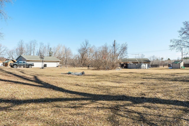27928 Verdin St NW, Isanti, MN 55040 - view of yard featuring an outbuilding and a detached carport