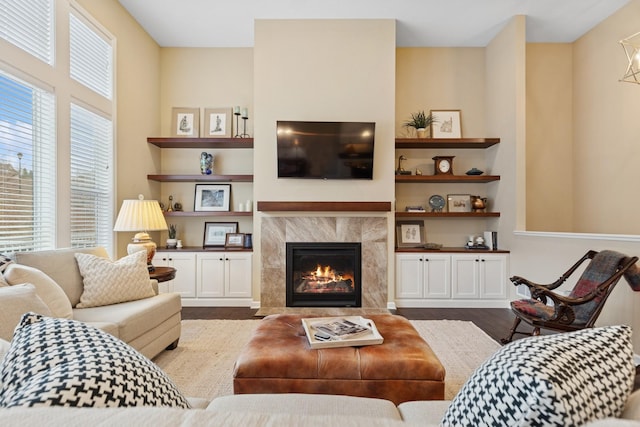 8127 Virginia Pl, Savage, MN 55378 - living area featuring a tile fireplace, wood finished floors, and built in shelves
