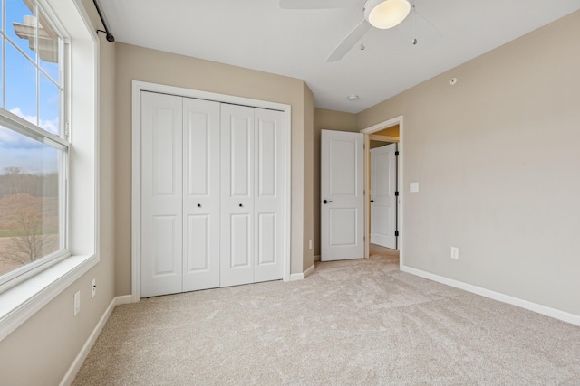 8127 Virginia Pl, Savage, MN 55378 - unfurnished bedroom with light carpet, multiple windows, and a closet