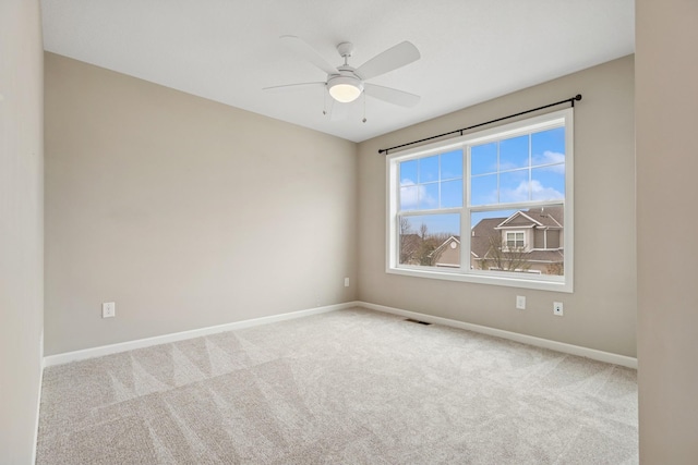 8127 Virginia Pl, Savage, MN 55378 - carpeted spare room with baseboards and a ceiling fan