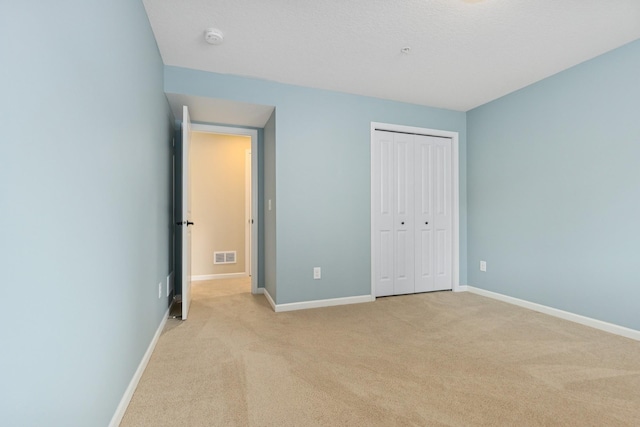 8127 Virginia Pl, Savage, MN 55378 - unfurnished bedroom with light colored carpet, baseboards, and a closet