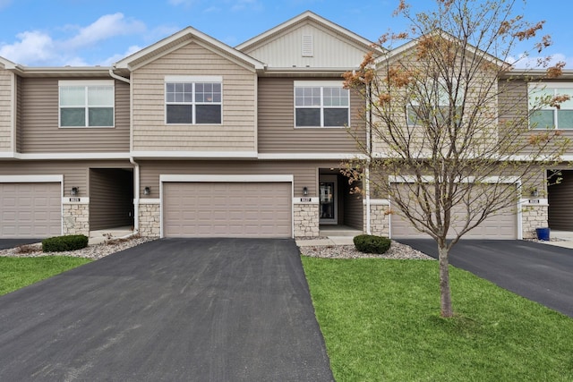 8127 Virginia Pl, Savage, MN 55378 - multi unit property featuring a garage, stone siding, driveway, and a front yard
