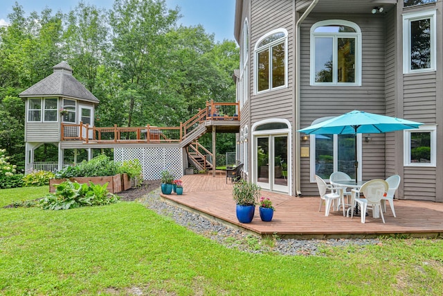 10069 Stacy Trl, Chisago City, MN 55013 - back of property with a deck, a yard, and stairway