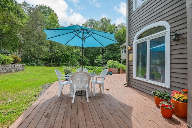 10069 Stacy Trl, Chisago City, MN 55013 - wooden deck featuring outdoor dining area and a yard