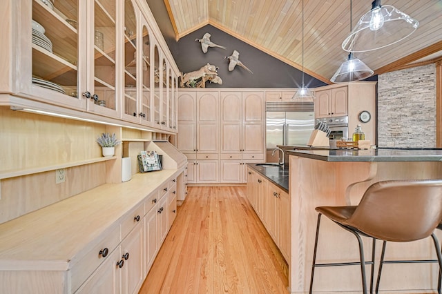 10069 Stacy Trl, Chisago City, MN 55013 - kitchen featuring appliances with stainless steel finishes, a sink, wooden ceiling, a breakfast bar area, and glass insert cabinets