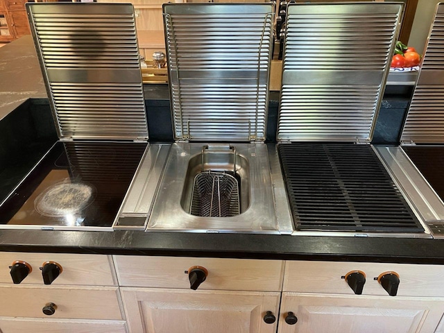 10069 Stacy Trl, Chisago City, MN 55013 - kitchen view of radiator heating unit and dark countertops