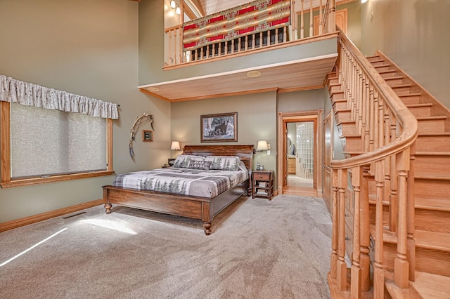 10069 Stacy Trl, Chisago City, MN 55013 - carpeted bedroom with a high ceiling and baseboards