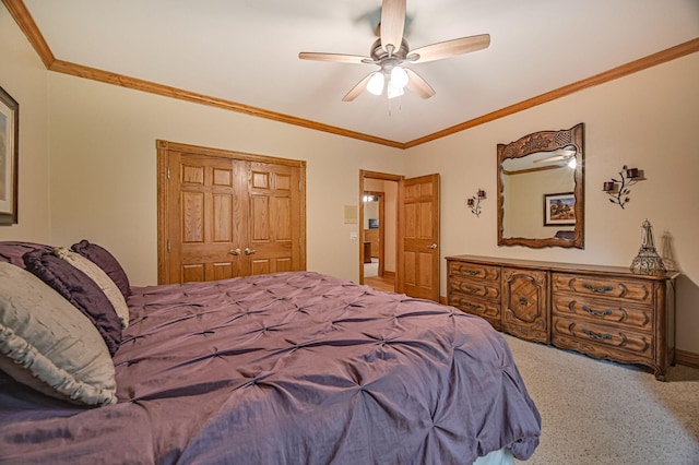10069 Stacy Trl, Chisago City, MN 55013 - bedroom featuring carpet floors, a closet, crown molding, ceiling fan, and baseboards