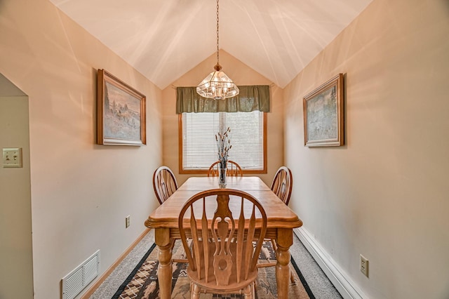10069 Stacy Trl, Chisago City, MN 55013 - dining room with a chandelier, baseboards, and lofted ceiling