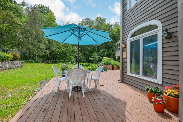 10069 Stacy Trl, Chisago City, MN 55013 - wooden terrace with outdoor dining space and a yard