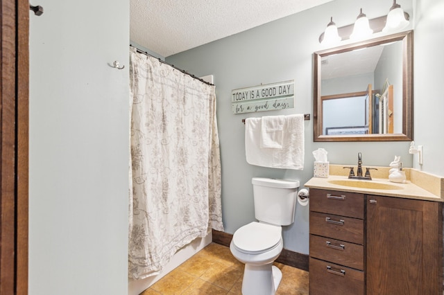 full bathroom featuring tile patterned floors, toilet, curtained shower, a textured ceiling, and vanity