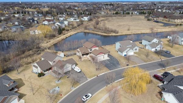 drone / aerial view with a residential view and a water view