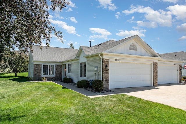 14502 Eureka Ct, Apple Valley, MN 55124 - ranch-style home featuring a garage, concrete driveway, a front yard, a shingled roof, and brick siding