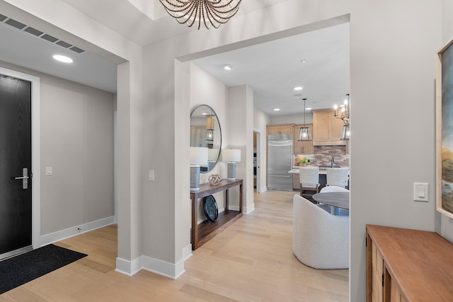 1 Hill Farm Rd Unit 210, North Oaks, MN 55127 - foyer entrance with light wood-style floors, recessed lighting, a notable chandelier, and baseboards