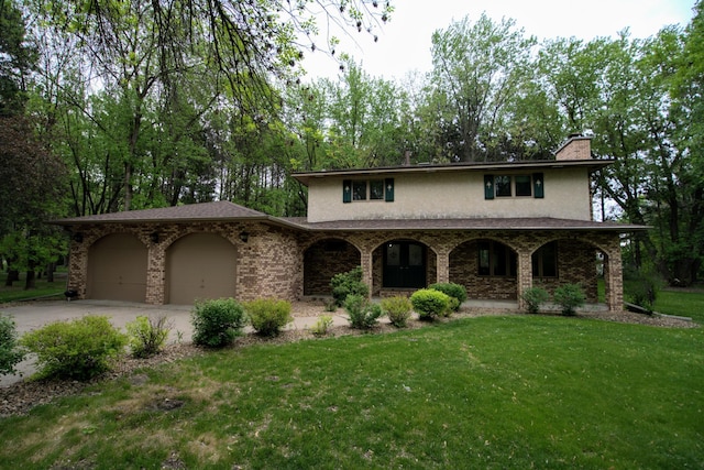 2342 75th Ave, Princeton, MN 55371 - view of front of home featuring a front lawn, concrete driveway, a garage, a porch, and a chimney