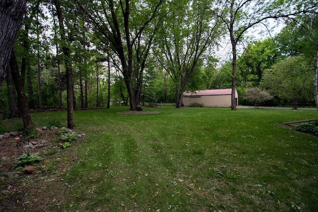 2342 75th Ave, Princeton, MN 55371 - view of grassy yard featuring a forest view