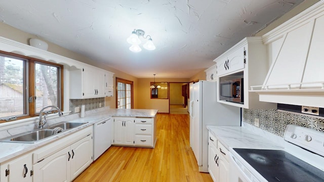 2342 75th Ave, Princeton, MN 55371 - kitchen featuring white appliances, a sink, a peninsula, and backsplash