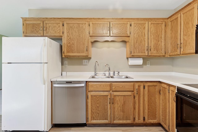 9904 95th Ave N, Maple Grove, MN 55369 - kitchen with dishwasher, freestanding refrigerator, a sink, oven, and light countertops