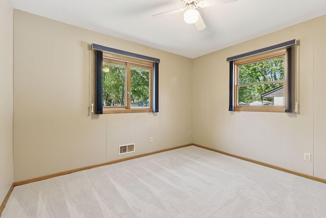 9904 95th Ave N, Maple Grove, MN 55369 - carpeted spare room with baseboards and a ceiling fan