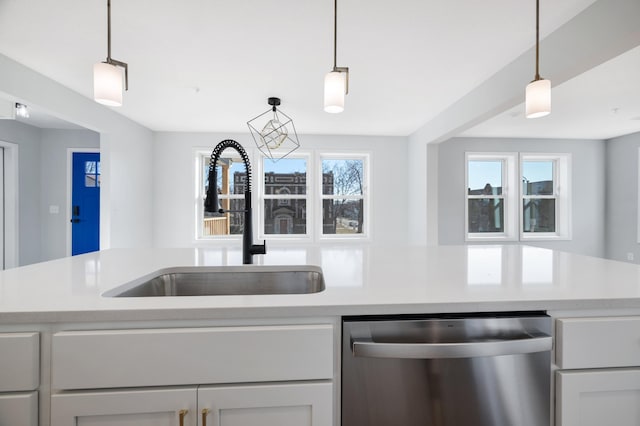 1903 Thomas Ave N, Minneapolis, MN 55411 - kitchen featuring plenty of natural light, stainless steel dishwasher, a sink, and light countertops
