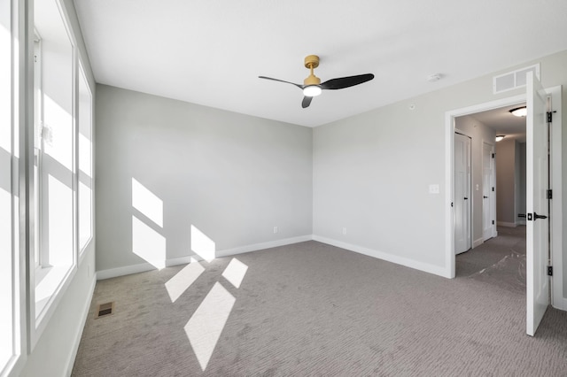 1903 Thomas Ave N, Minneapolis, MN 55411 - spare room with baseboards, visible vents, carpet floors, and ceiling fan