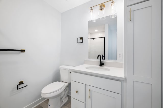 1903 Thomas Ave N, Minneapolis, MN 55411 - full bath with a shower with shower door, toilet, vanity, and wood finished floors