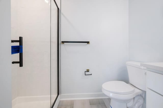 1903 Thomas Ave N, Minneapolis, MN 55411 - full bath featuring baseboards, toilet, vanity, and a stall shower