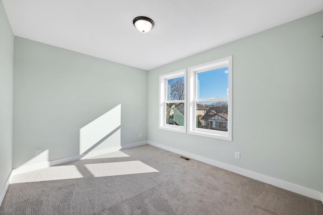 1903 Thomas Ave N, Minneapolis, MN 55411 - spare room with carpet floors, visible vents, and baseboards