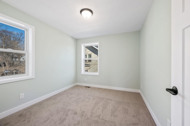 1903 Thomas Ave N, Minneapolis, MN 55411 - empty room featuring visible vents, baseboards, and carpet floors