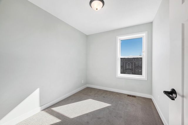 1903 Thomas Ave N, Minneapolis, MN 55411 - carpeted spare room with visible vents and baseboards