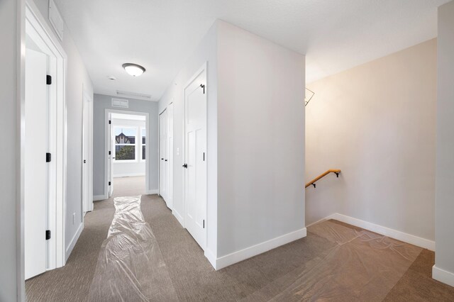 1903 Thomas Ave N, Minneapolis, MN 55411 - corridor with baseboards, carpet floors, and an upstairs landing