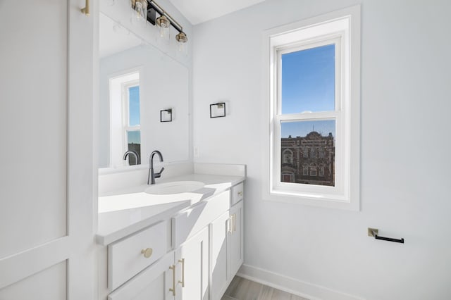 1903 Thomas Ave N, Minneapolis, MN 55411 - bathroom featuring baseboards and vanity