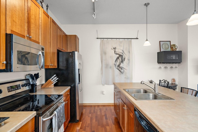 4525 Park Commons Dr Unit 221, Saint Louis Park, MN 55416 - kitchen featuring a sink, brown cabinetry, dark wood-style floors, and appliances with stainless steel finishes