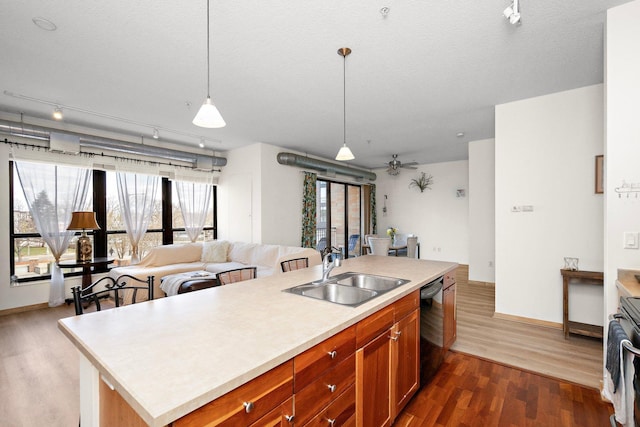 4525 Park Commons Dr Unit 221, Saint Louis Park, MN 55416 - kitchen featuring a sink, light countertops, dark wood-style floors, and black dishwasher