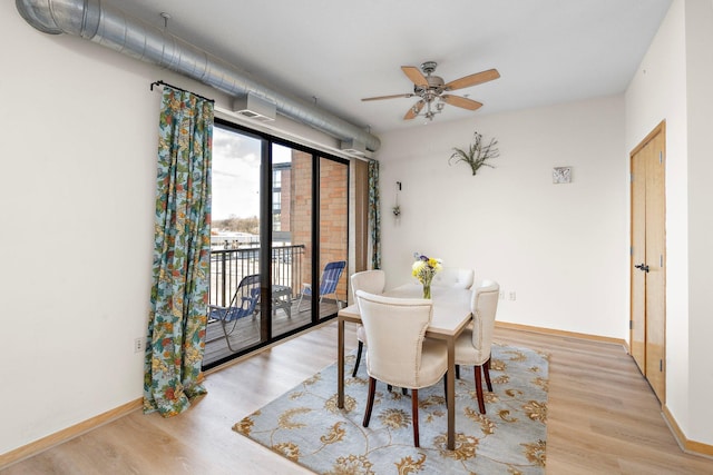 4525 Park Commons Dr Unit 221, Saint Louis Park, MN 55416 - dining space with a ceiling fan, baseboards, and wood finished floors