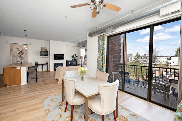 4525 Park Commons Dr Unit 221, Saint Louis Park, MN 55416 - dining space with a ceiling fan, baseboards, and light wood-style flooring