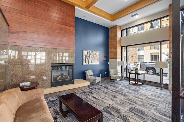 4525 Park Commons Dr Unit 221, Saint Louis Park, MN 55416 - living room with carpet, visible vents, recessed lighting, a high ceiling, and a tile fireplace