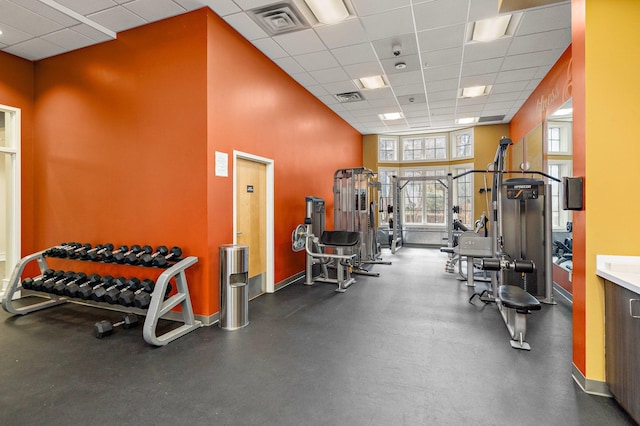 4525 Park Commons Dr Unit 221, Saint Louis Park, MN 55416 - workout area featuring baseboards, a drop ceiling, visible vents, and a towering ceiling