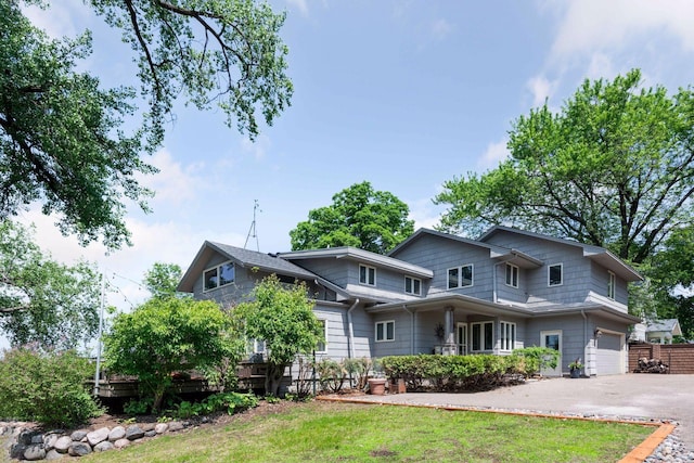 5150 Meadville St, Greenwood, MN 55331 - view of front facade with an attached garage and asphalt driveway