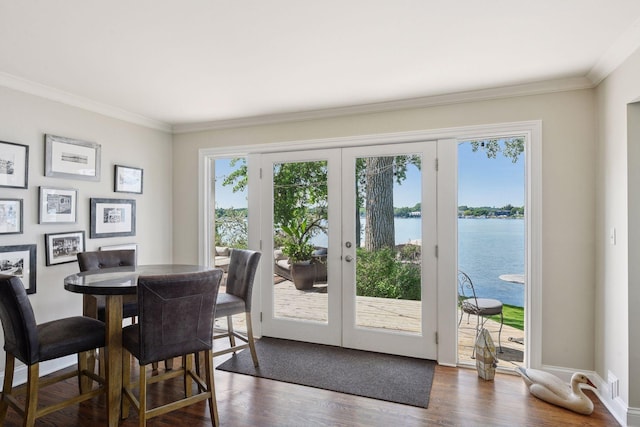 5150 Meadville St, Greenwood, MN 55331 - dining space featuring french doors, crown molding, dark wood finished floors, and a water view