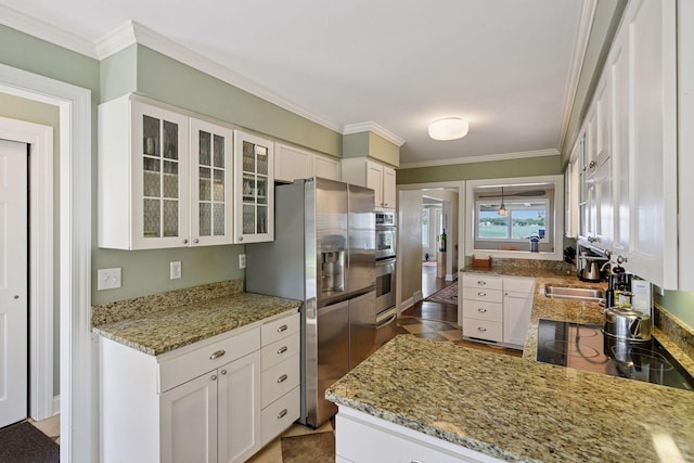 5150 Meadville St, Greenwood, MN 55331 - kitchen with stainless steel appliances, ornamental molding, glass insert cabinets, white cabinetry, and light stone countertops