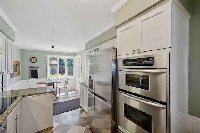 5150 Meadville St, Greenwood, MN 55331 - kitchen featuring appliances with stainless steel finishes, white cabinets, ornamental molding, dark stone counters, and hanging light fixtures
