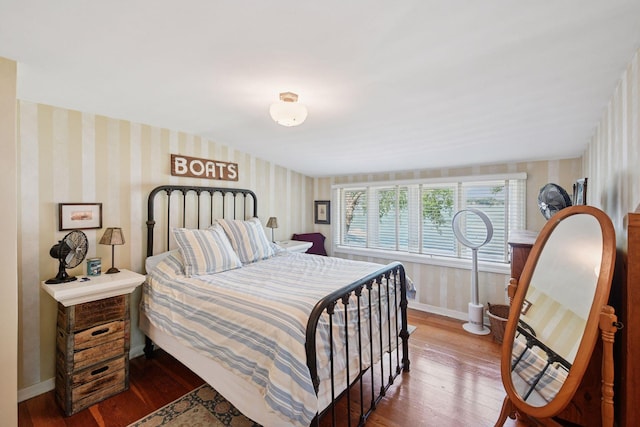5150 Meadville St, Greenwood, MN 55331 - bedroom featuring wallpapered walls and hardwood / wood-style floors