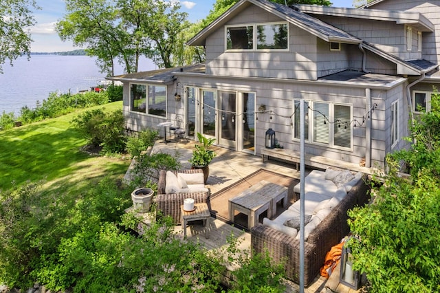 5150 Meadville St, Greenwood, MN 55331 - back of property with an outdoor living space, a deck with water view, and a yard