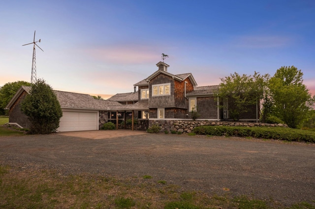 12697 177th St N, May Twp, MN 55047 - shingle-style home with dirt driveway, an attached garage, and stone siding