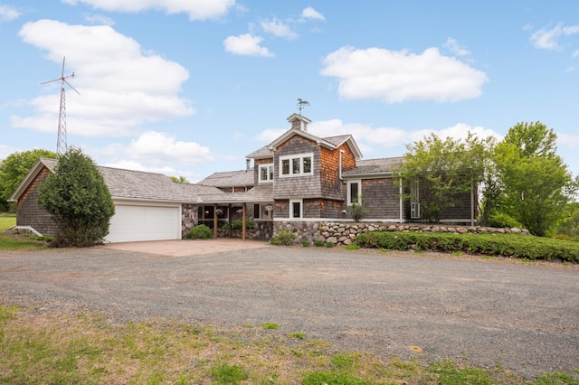 12697 177th St N, May Twp, MN 55047 - view of front of home featuring driveway, an attached garage, and stone siding